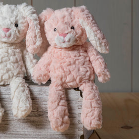 Mary Meyer Putty Pups blush bunny fabric nose showcases stitched construction for lasting play.