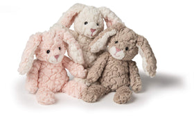 Mary Meyer Putty Pups blush bunny full view highlights weighted bum and feet for comforting hold.