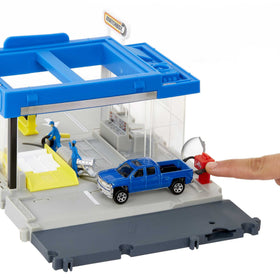 Matchbox Auto Shop lift lever raises cars for servicing play.