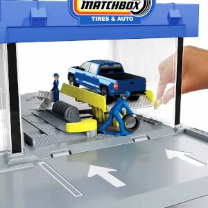 Matchbox Auto Shop mechanic figures greet vehicles for engine maintenance play.
