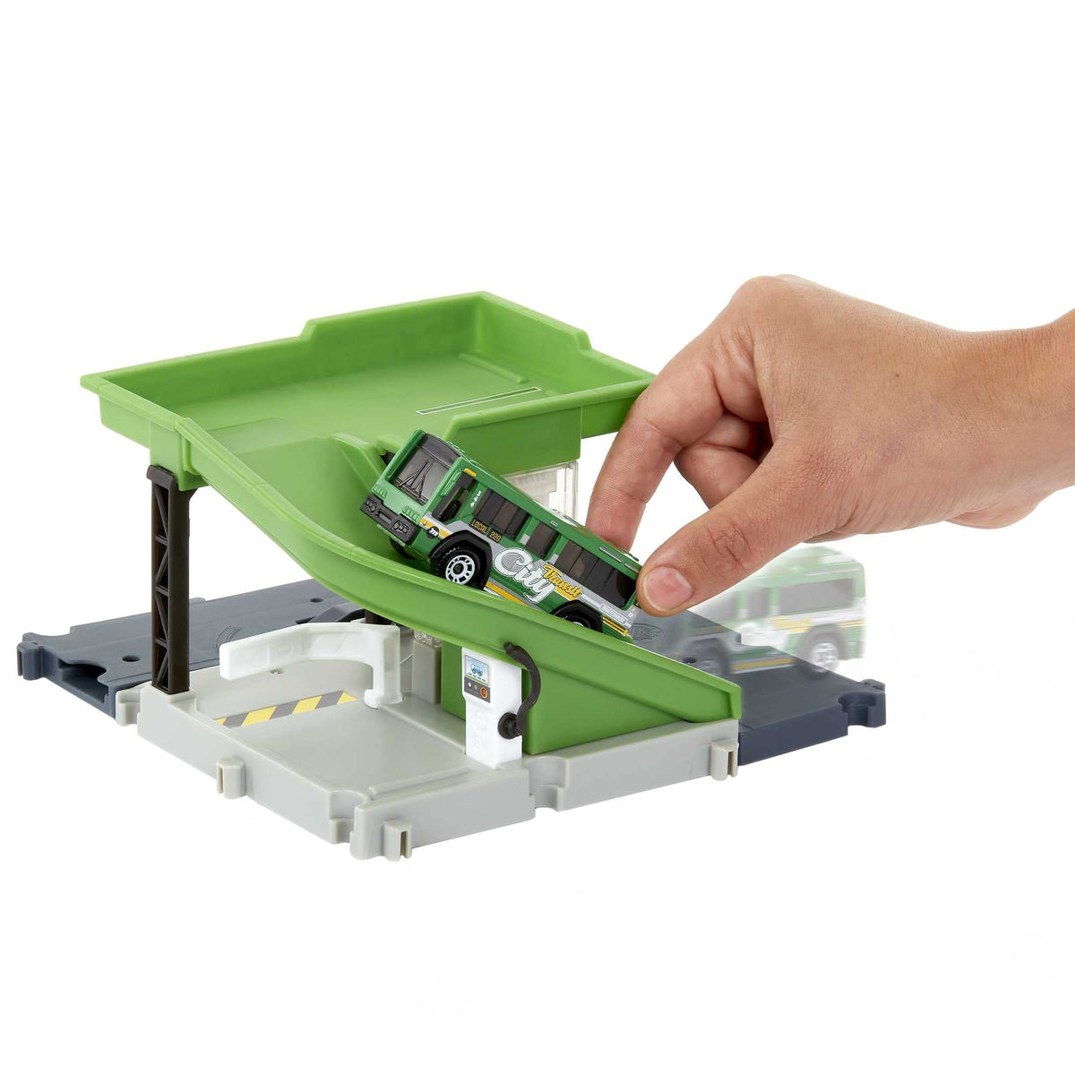 Matchbox Bus Station Track interior features a charging station for interactive play.
