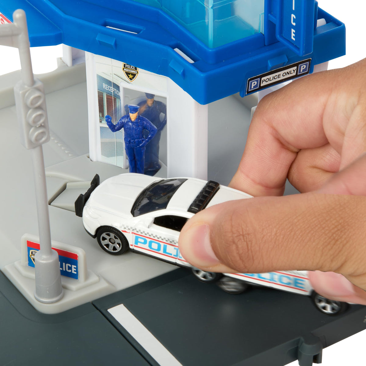 Matchbox moving figure activated by approaching vehicle adds dynamic play moments.