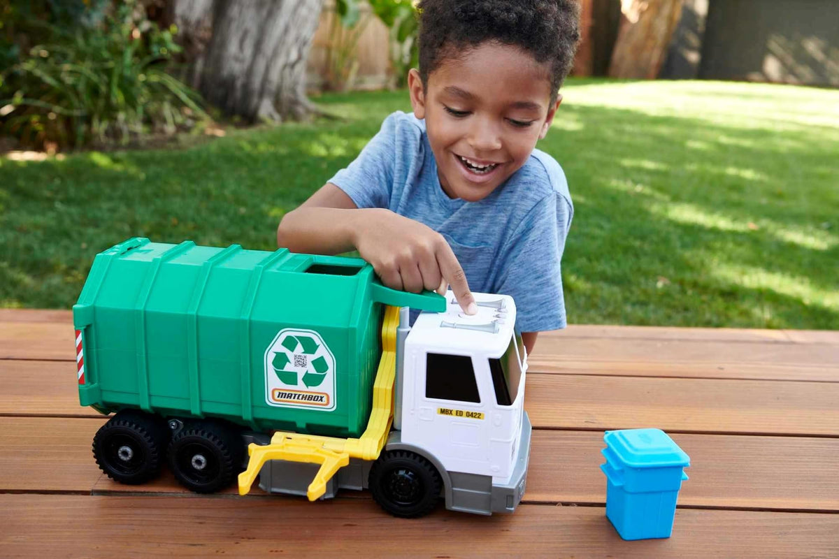 Matchbox recycling truck raise-bin lever demonstrates curbside bin action for kids.