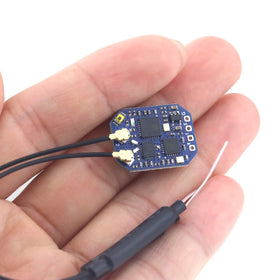 The MATEK ELRS-R24-D receiver mounted inside a tiny FPV drone frame.