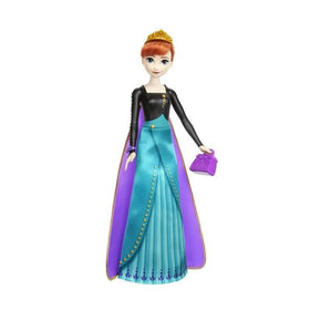 Doll reveal shows Anna with removable skirt and cape for styling
