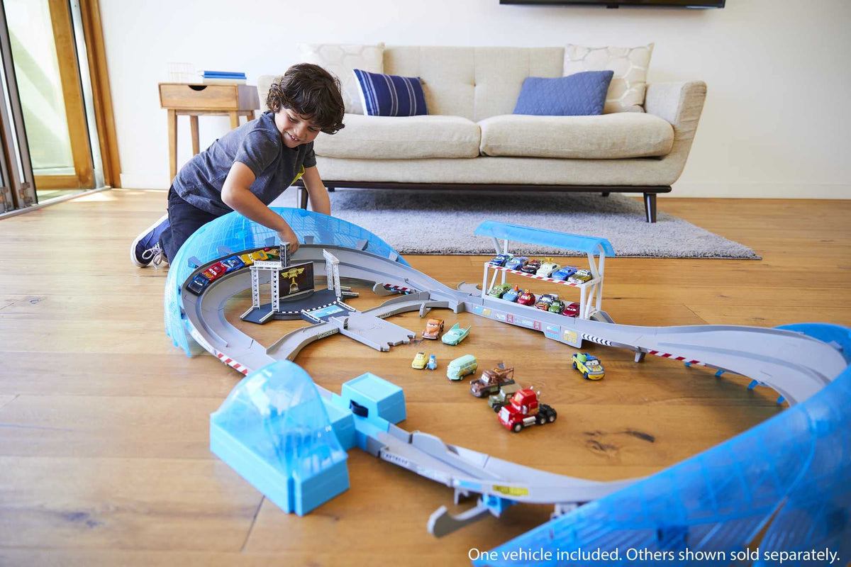 Lightning McQueen on motorized booster delivering high-speed play