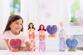 Mattel Ariel heart gem on top highlighting a magical unboxing moment.