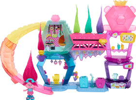 Mattel DreamWorks Trolls Mount Rageous Queen Poppy doll beside the playset for imaginative storytelling