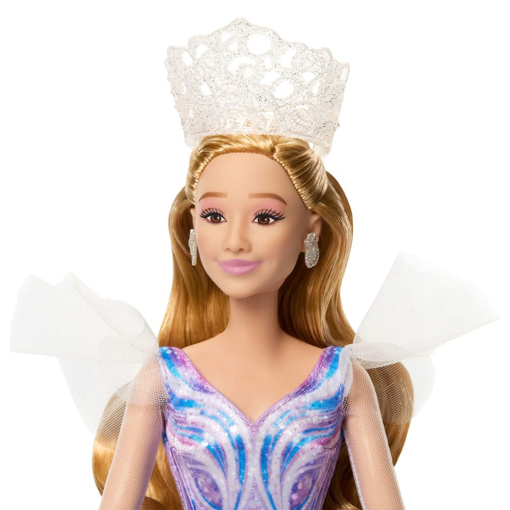 Mattel Glinda shimmery long sleeves add screen-inspired glamour.