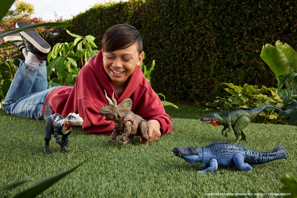 Mattel Jurassic World Rebirth tail attack motion shows vertical chomping during action play.