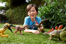 Mattel Jurassic World tail-attack action highlighting dynamic dinosaur strike.