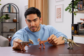 Mattel Jurassic World Troodon figure showcasing 14 articulation points for posing.