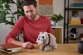 Dennis Wolf plush mouth action activates when feeding the bone for interactivity.