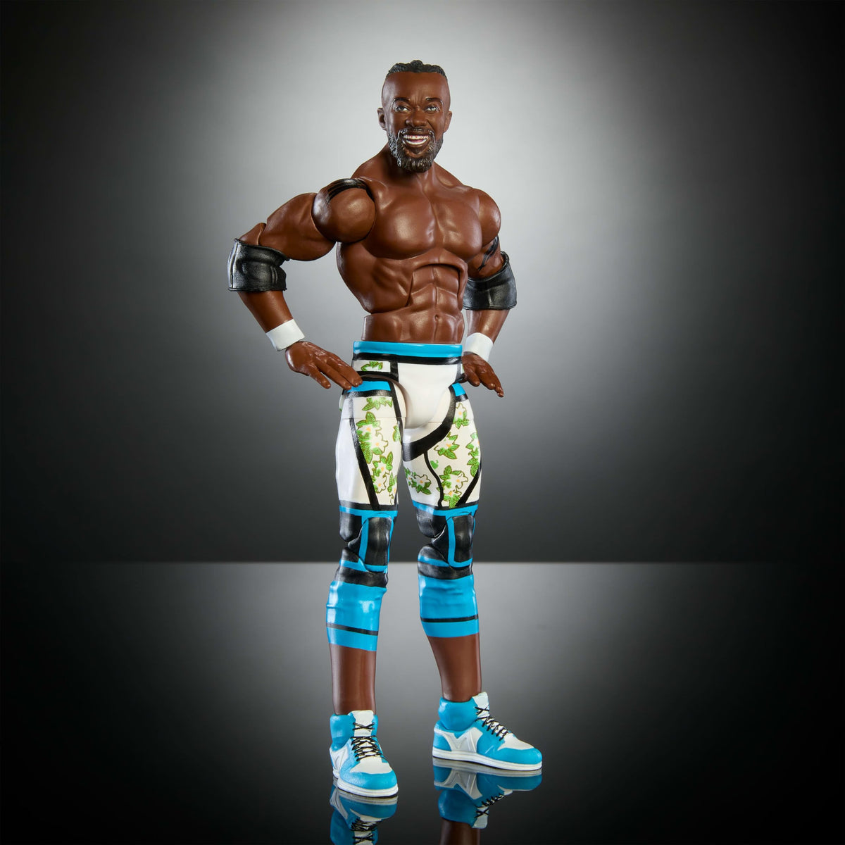 Mattel WWE Elite Kofi Kingston figure with iconic accessories for authentic ring play.