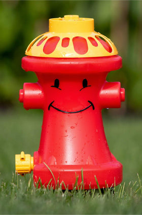 Matty's Toy Stop Henry Hydrant sprinkler attached to hose for backyard fun