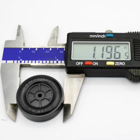 Ready-to-install Maximum Velocity derby wheels shown on a pinewood derby project.