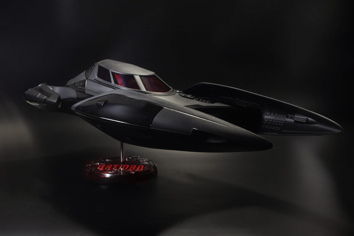 McFarlane Toys DC Multiverse Batmobile Batman Beyond lights illuminate dynamic shelf presentation.