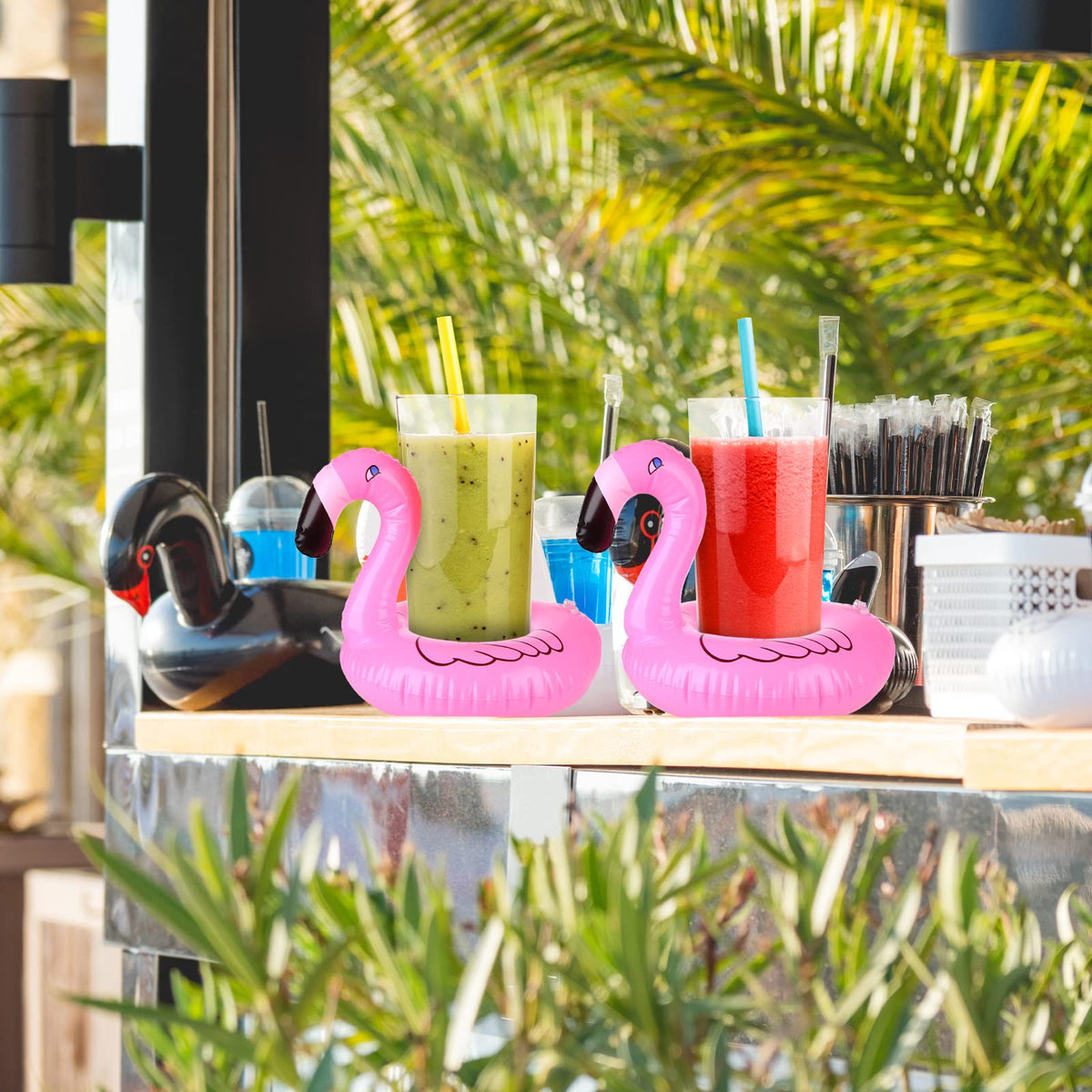 Meanplan pink flamingo cup float with pump cylinder for quick setup.