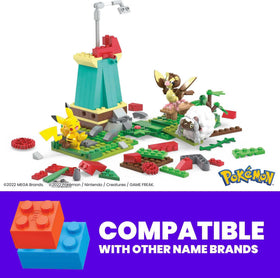 Mega Bloks Pokemon Pidgey figure beside windmill, promoting creative play and world-building.
