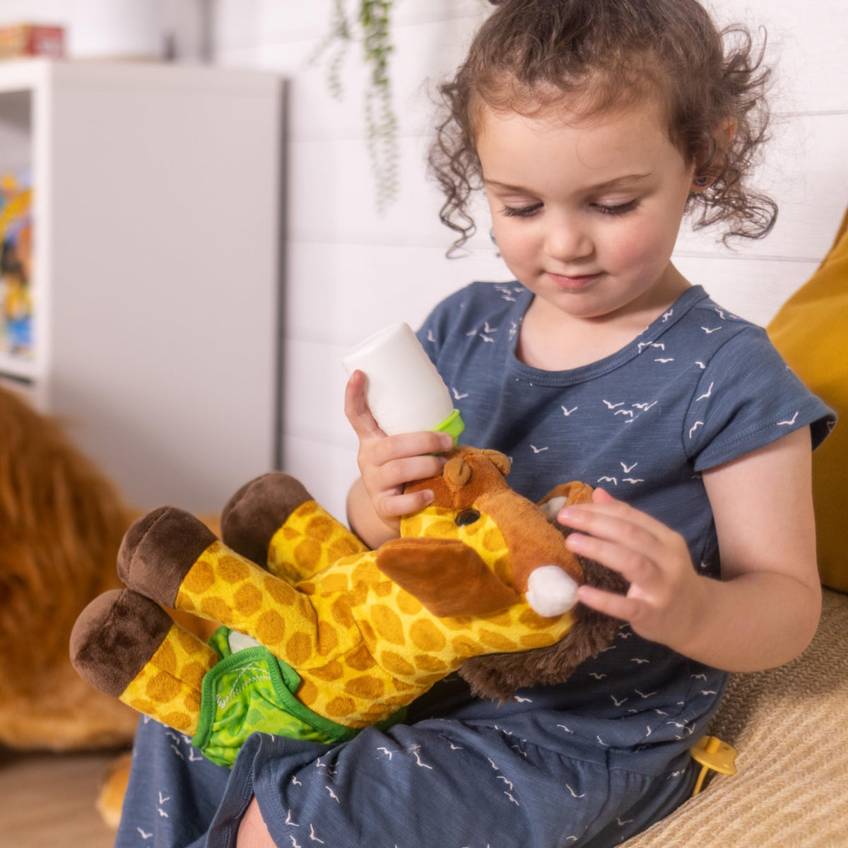 Melissa and Doug 11-inch giraffe sits tall for display and snuggle scenes.