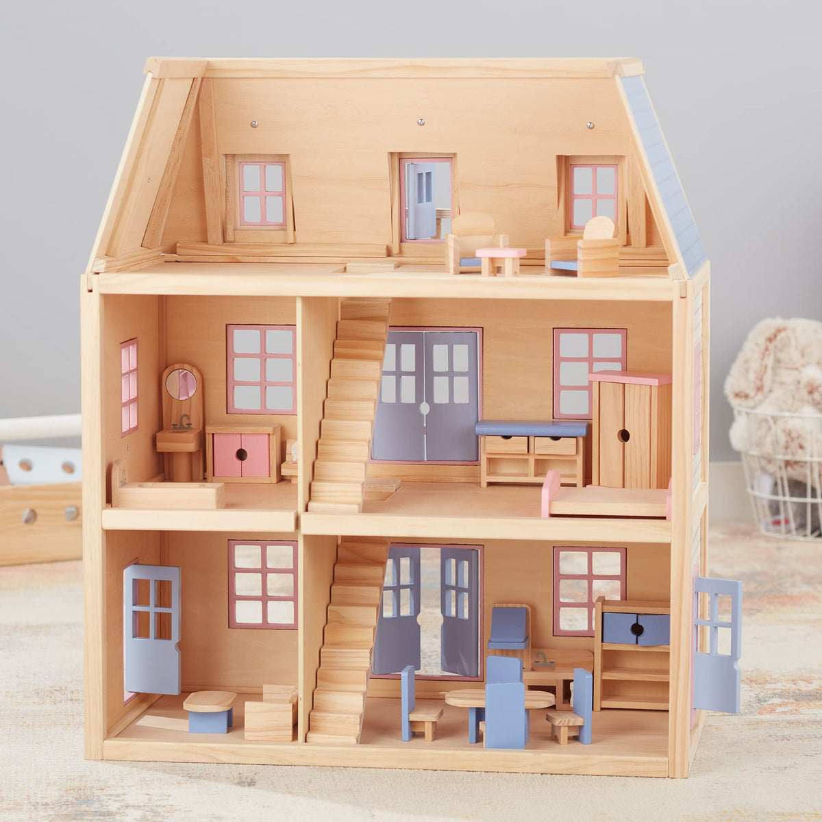 Nineteen hand-painted wooden furniture pieces fit inside drawers for organized pretend play.