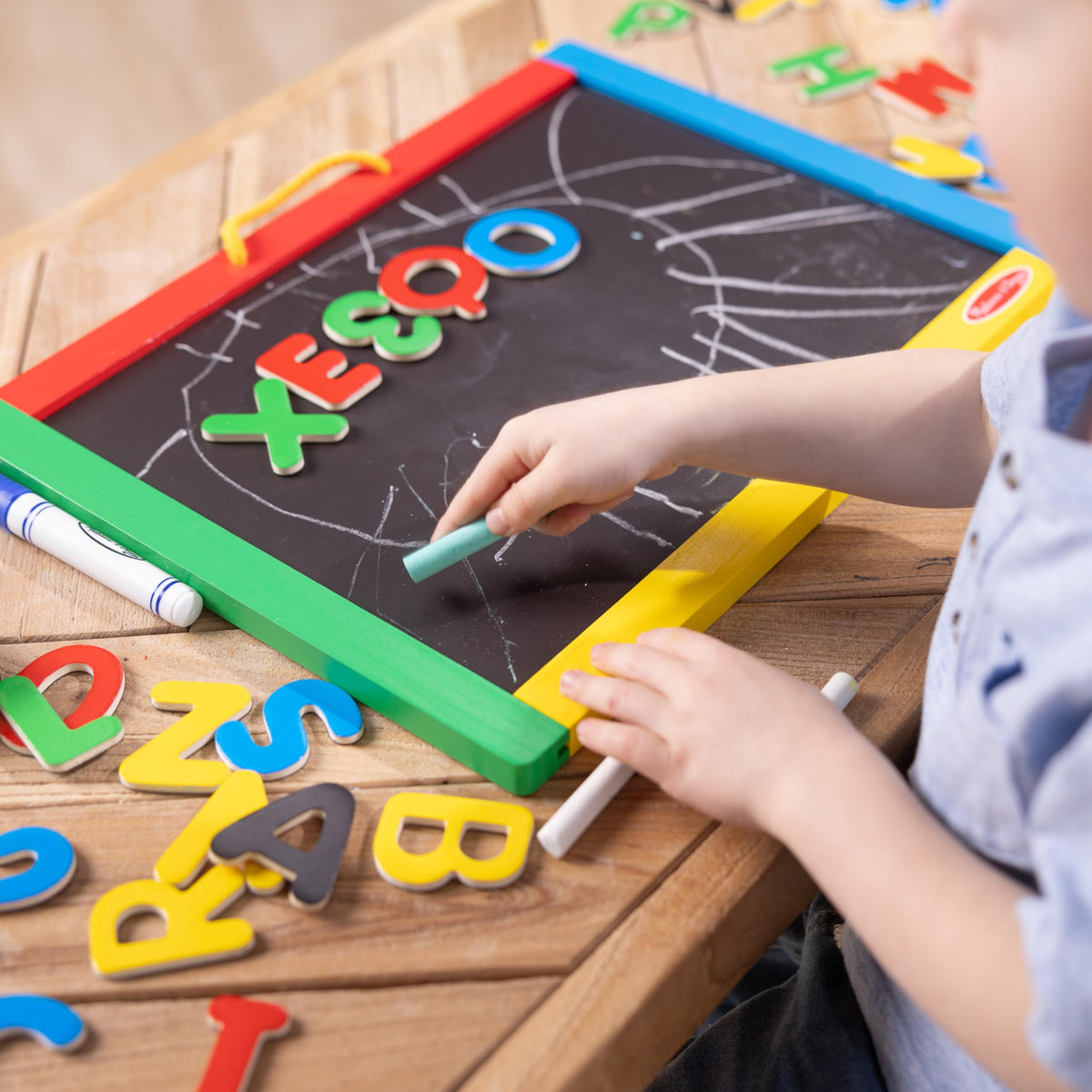 Melissa & Doug 36 magnets for uppercase letters and numbers on the board.