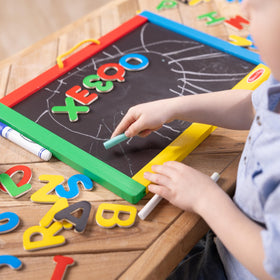 Melissa & Doug 36 magnets for uppercase letters and numbers on the board.