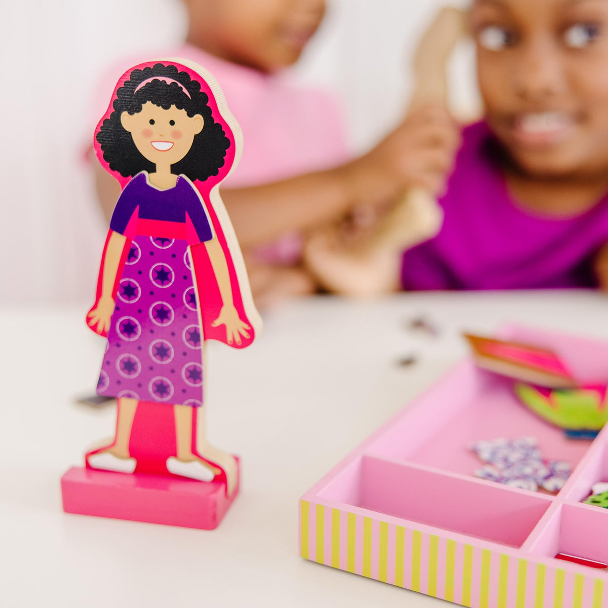 56-piece magnetic outfits for Abby and Emma to mix and match.
