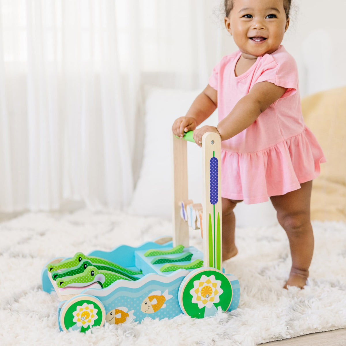 Melissa & Doug wooden beads on the push toy spin for tactile exploration