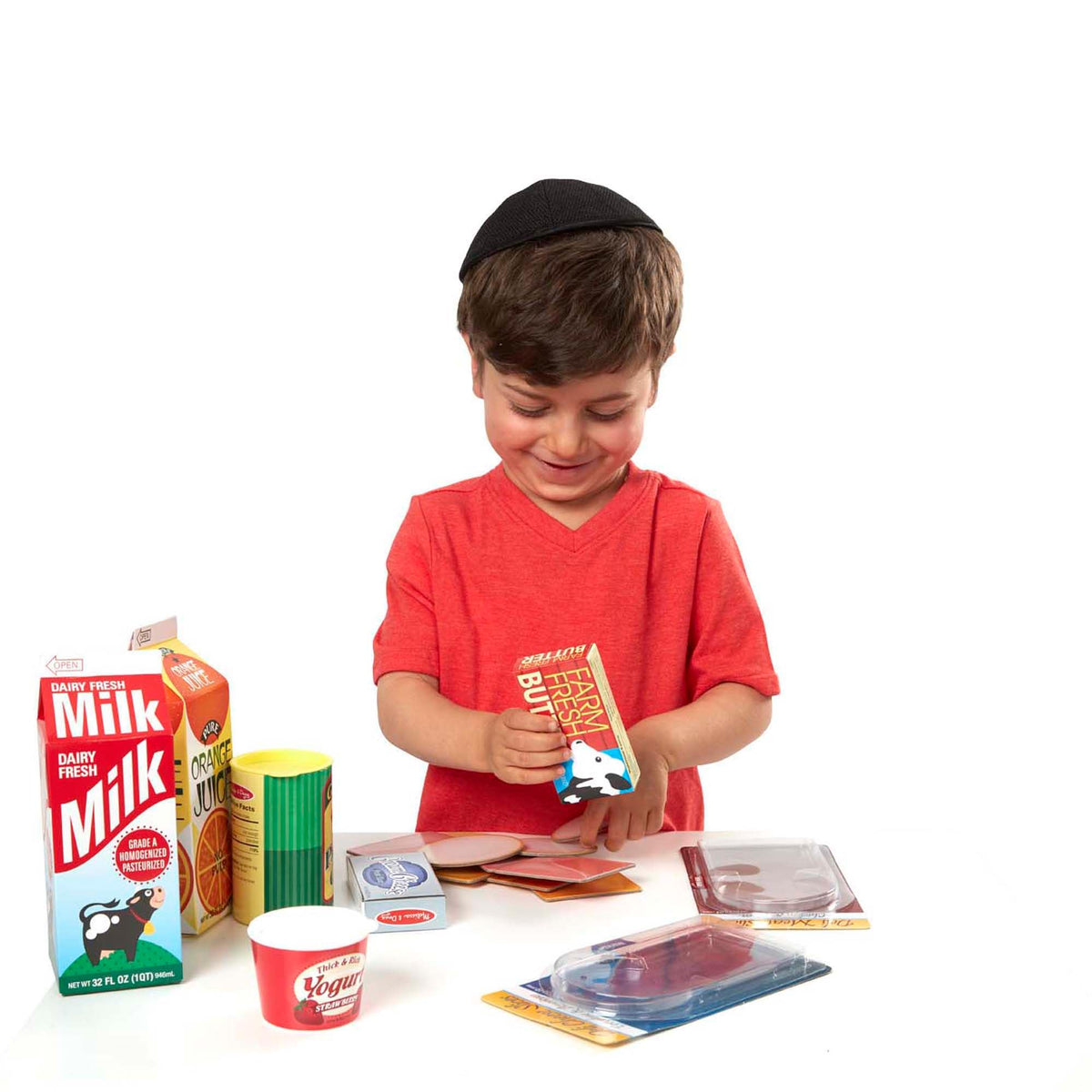 Melissa & Doug assorted play food slices and cartons for engaging kitchen play.