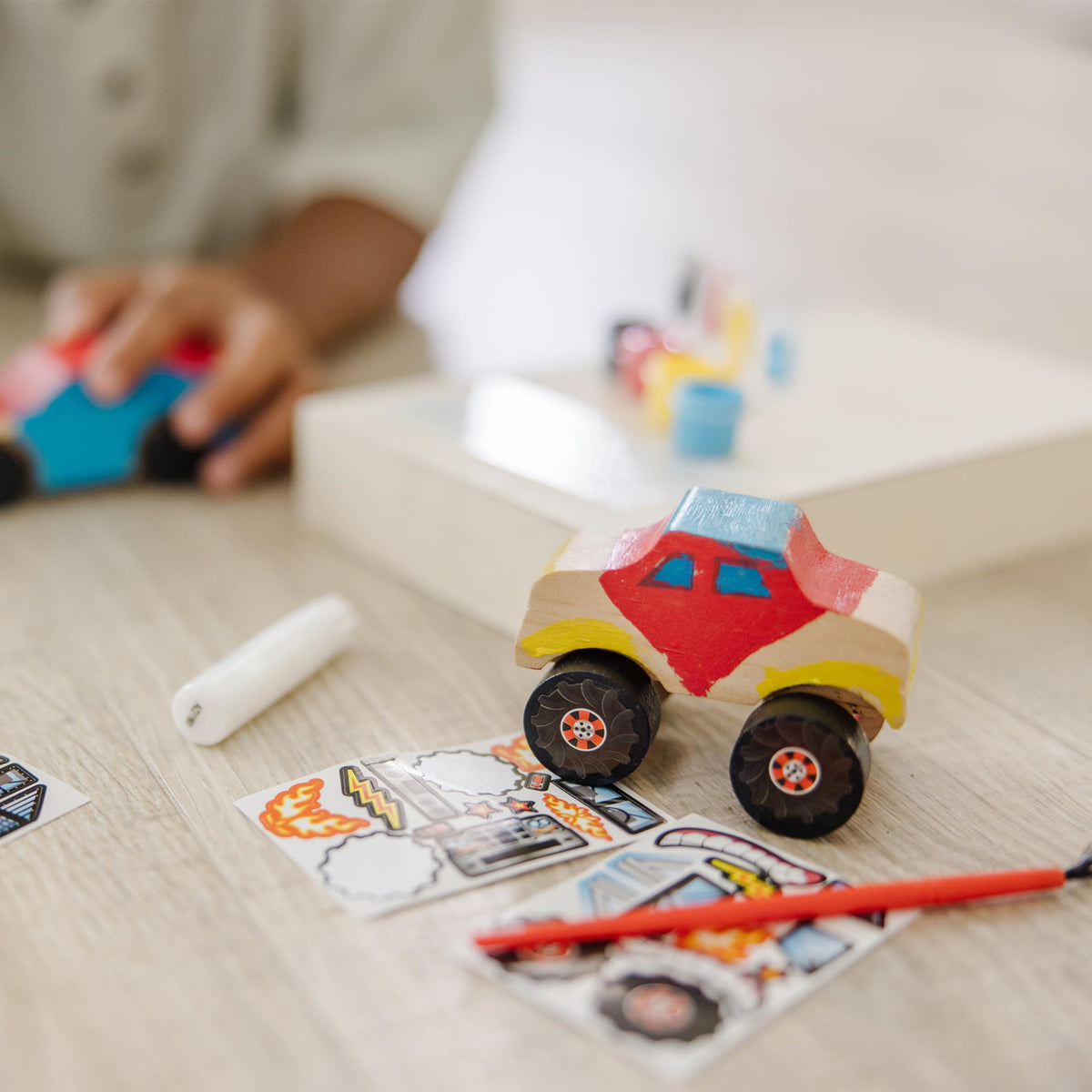 Wooden axles and wheels in Melissa & Doug kit enable functional pretend cars.