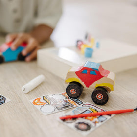 Wooden axles and wheels in Melissa & Doug kit enable functional pretend cars.