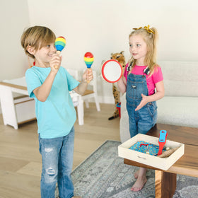 Melissa & Doug Band-in-a-Box cymbals introduce dynamic sound and tapping exploration.