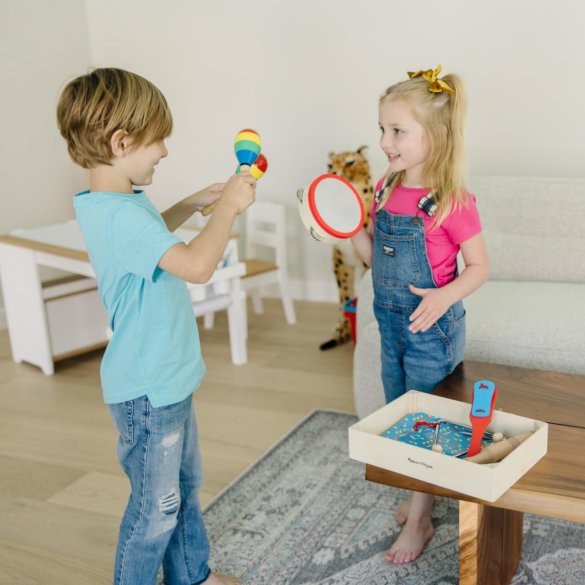 Melissa & Doug Band-in-a-Box wooden crate keeps instruments organized and ready.