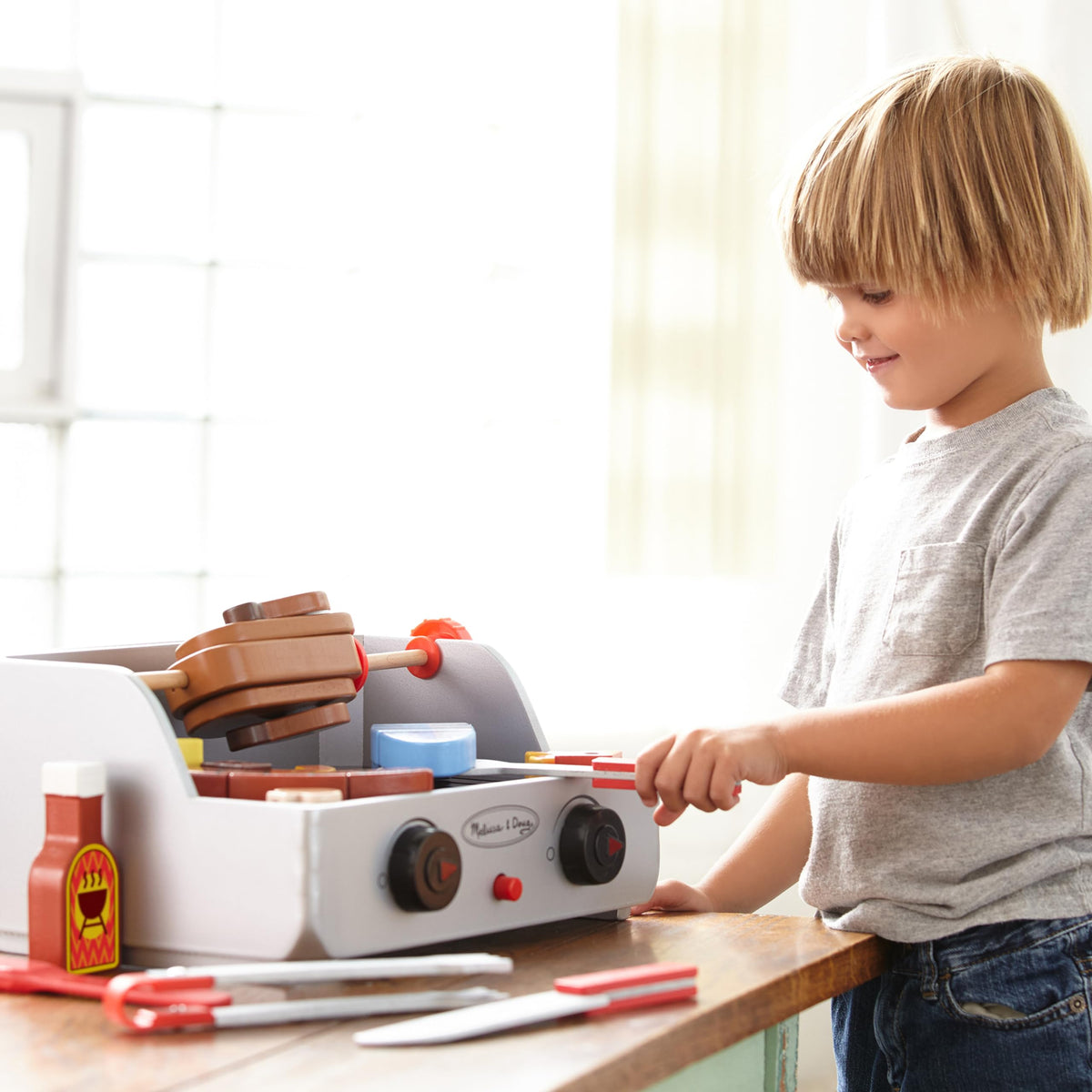 Melissa & Doug basting brush for kid-friendly sauce application.