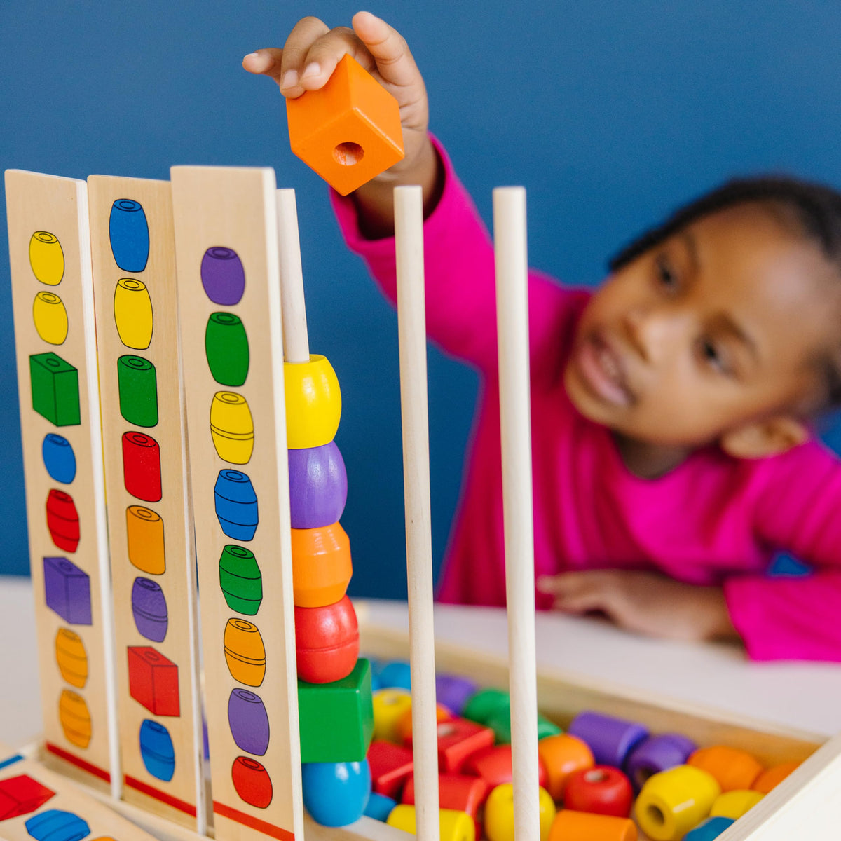 Melissa and Doug Bead Sequencing Set pattern cards aid pattern recognition during play