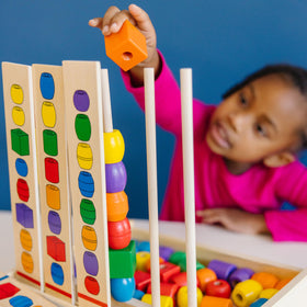 Melissa and Doug Bead Sequencing Set pattern cards aid pattern recognition during play