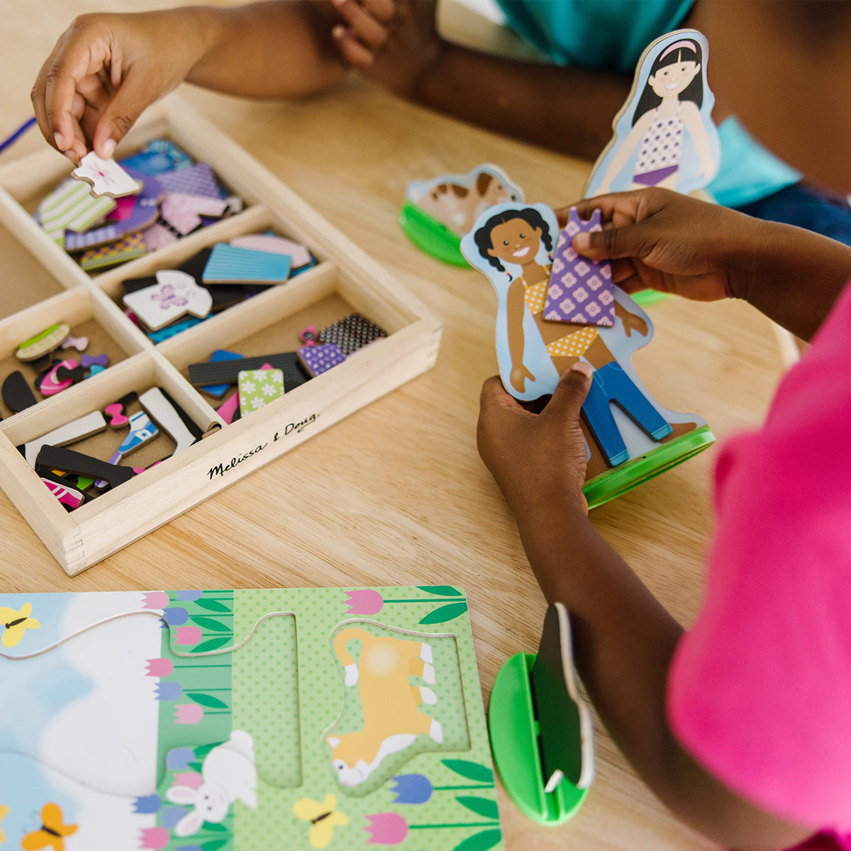 Melissa & Doug Best Friends double-sided dolls for quick outfit changes.