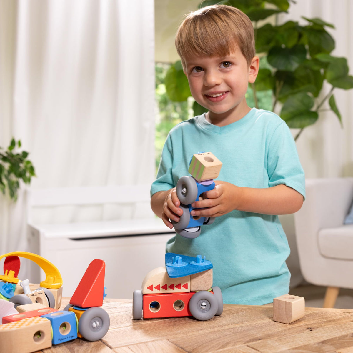 Melissa & Doug Blockables airplane with felt propeller invites storytelling.