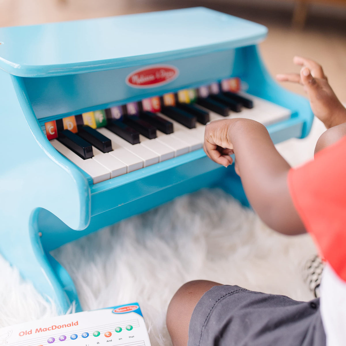 Melissa & Doug blue piano compact size fits small play areas.