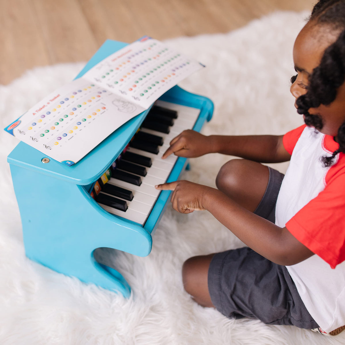 Melissa & Doug blue piano keyboard close-up highlighting 25 keys.