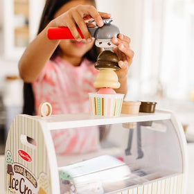 Melissa & Doug wooden scoops in bright colors for kid-friendly scooping fun.