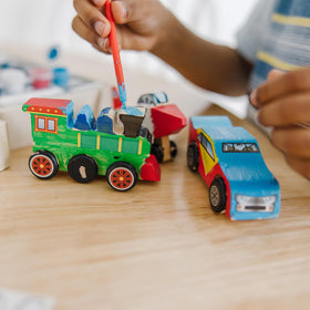 Brush and stickers set to personalize each vehicle by Melissa & Doug.