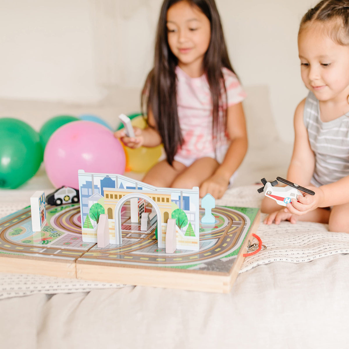 Melissa and Doug wooden buildings and signs enrich the city landscape