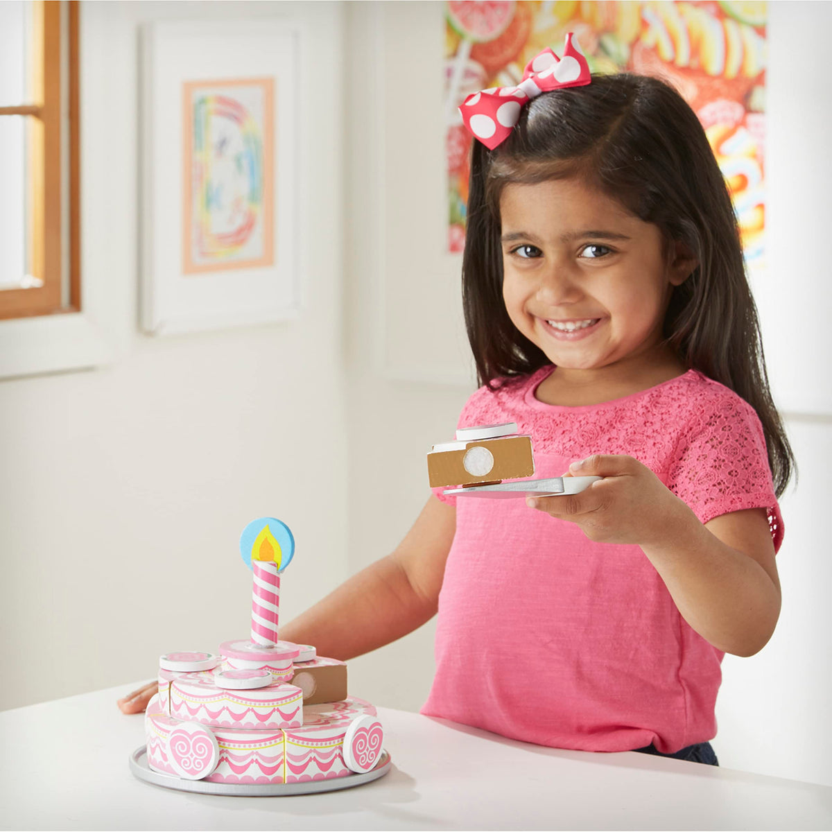 Candle topping adds a celebratory touch to pretend cake.