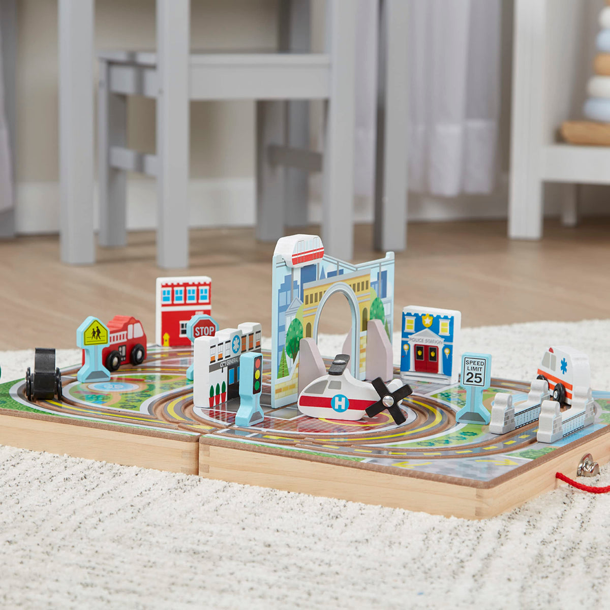 Melissa and Doug town set stores neatly in a portable wooden case