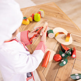 Child wearing Melissa & Doug full chef ensemble sparks storytelling and cooperative play