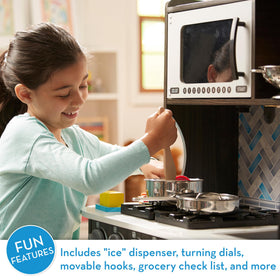 Melissa & Doug microwave with turning plate supports realistic kitchen role play.
