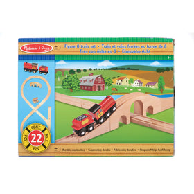 Child enjoys tactile learning while playing with the Figure Eight Train set.