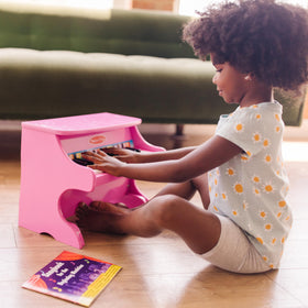 Melissa & Doug color-coded songbook helps kids follow notes easily.